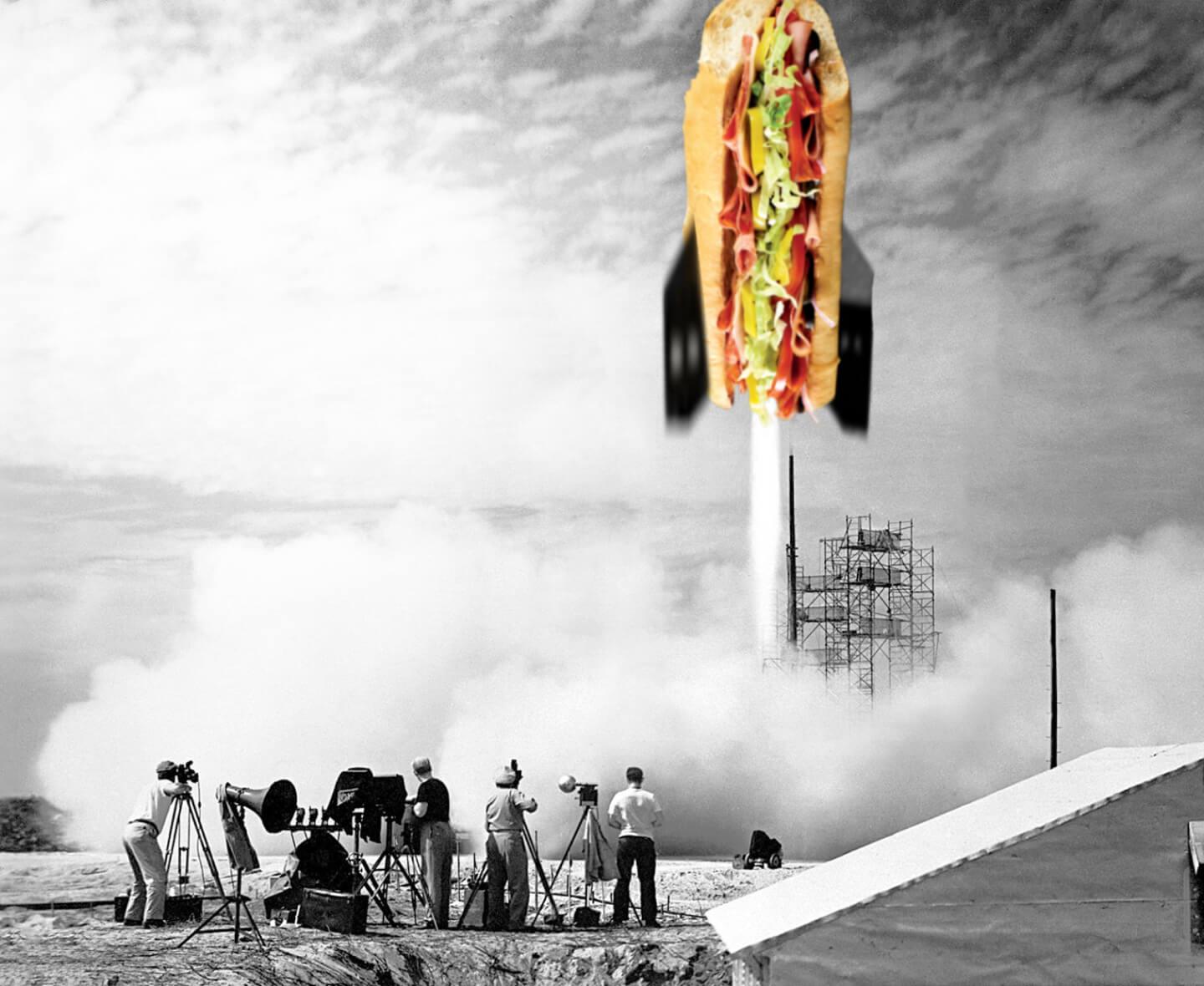 A group of men filming the launch of a Quiznos sub rocket launching into space
